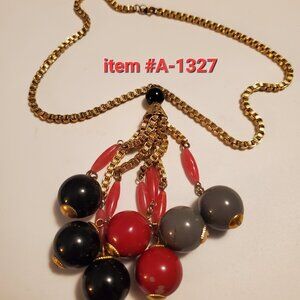 1 Gold necklace with ball tassels, item # A-1327 , wt. 46 grams.